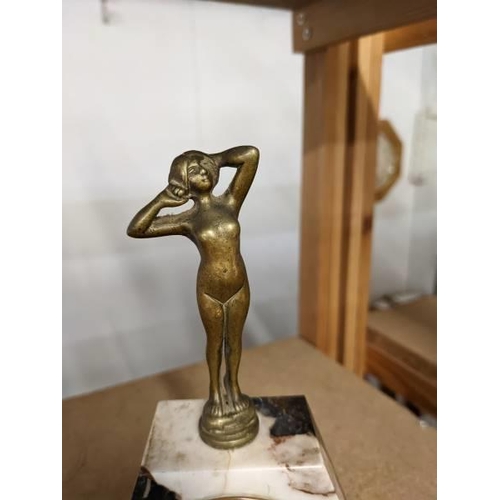 284 - An art deco marble mantel clock surmounted figure, base 13 x 4.5 cm, height 19.5 cm.