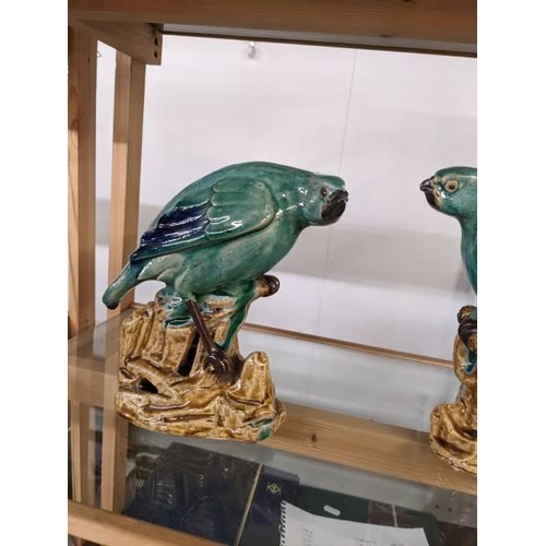 292 - A pair of green ceramic parrots.