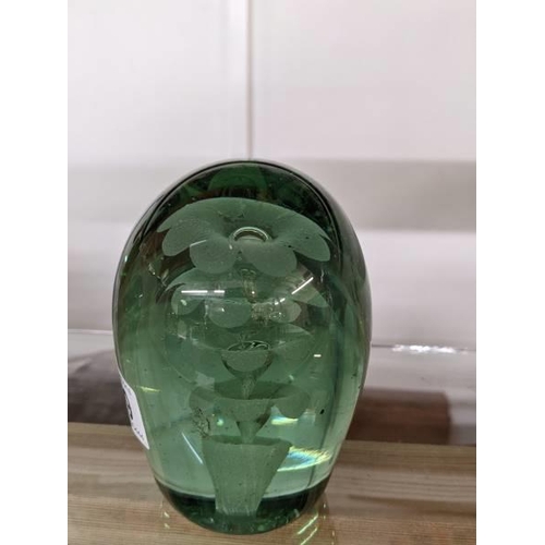 299 - A Victorian green glass dump/paperweight.