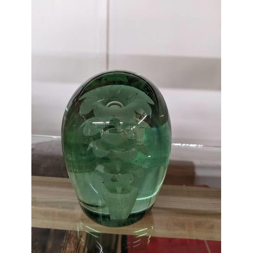 299 - A Victorian green glass dump/paperweight.