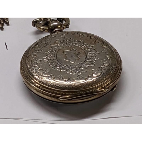 100E - A silver pocket watch on a silver chain.