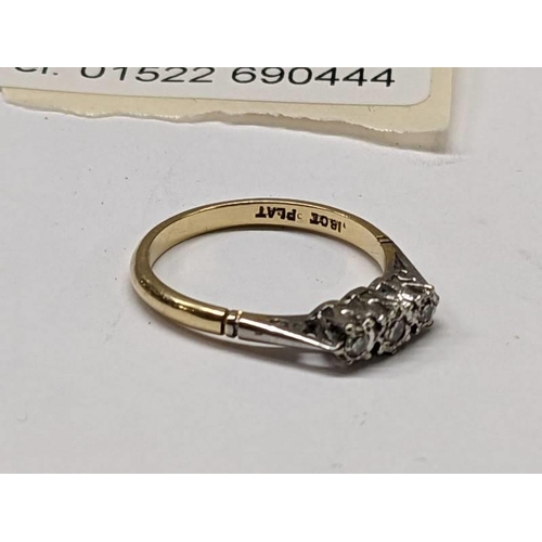 100F - An 18ct gold ring set three good diamonds, size L, 2.4 grams.