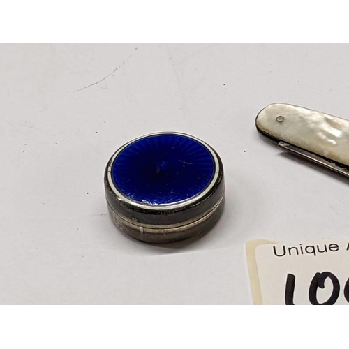 100J - A silver and enamel pill box and a silver and mother of pearl pen knife.