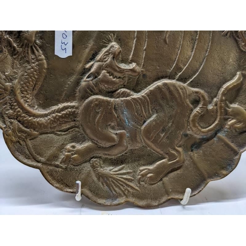 306 - A heavy metal oriental dragon plate.