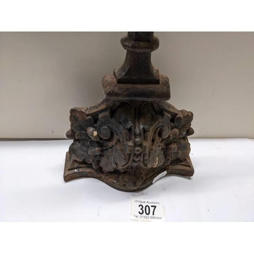 307 - A cast iron door stop.