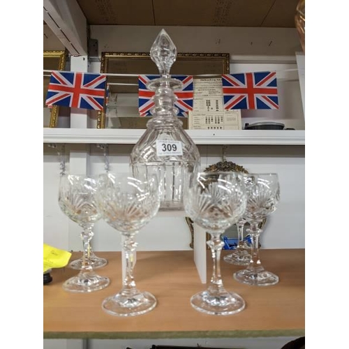 309 - A cut glass decanter and six goblets.