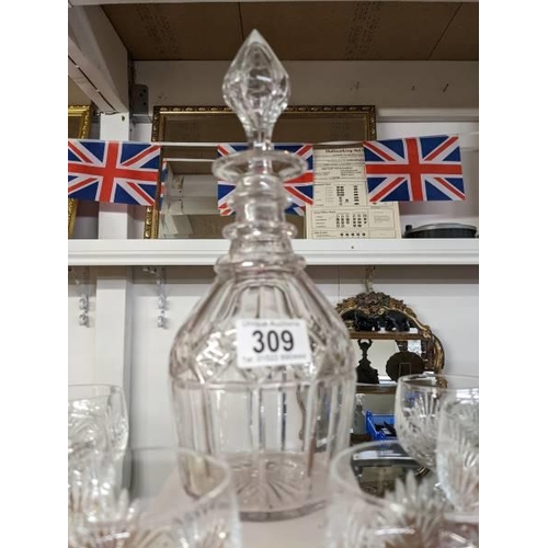 309 - A cut glass decanter and six goblets.