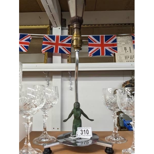 310 - An original chrome art deco table lamp with verdigree spelter kneeling nude with rare street lantern... 