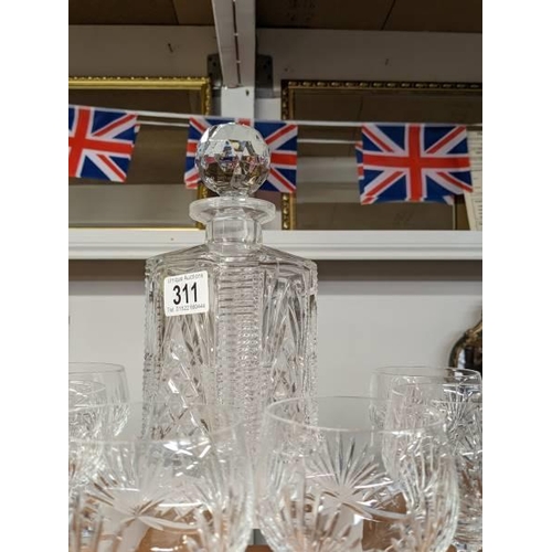 311 - A cut glass decanter and six goblets.