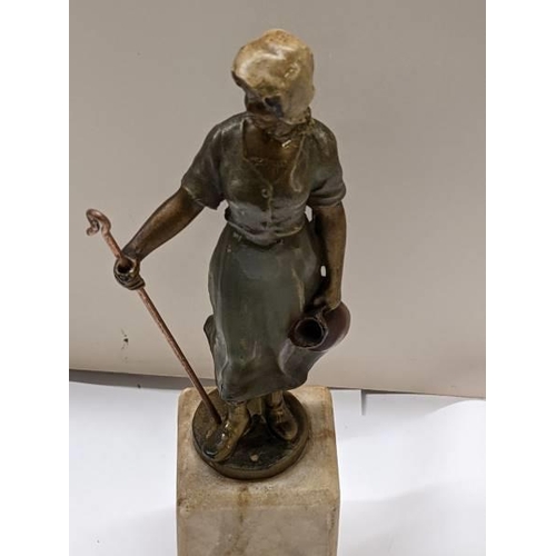 193 - A pair of cold painted bronzes of a shepherdess and a tramp on marble bases, early 20th century. Bot... 