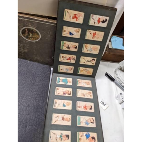 194 - A good selection of cigarette cards in albums.