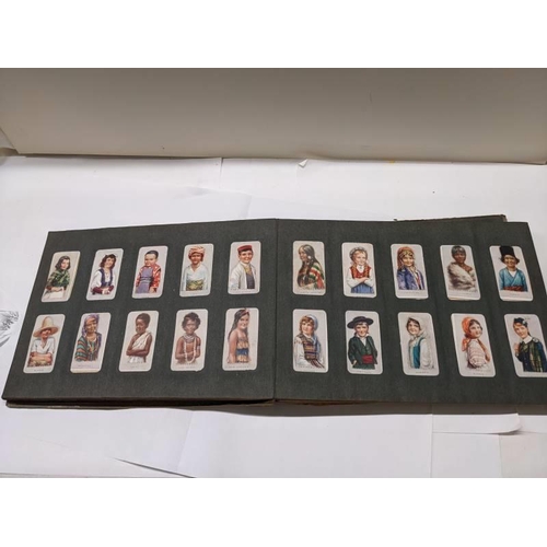 194 - A good selection of cigarette cards in albums.