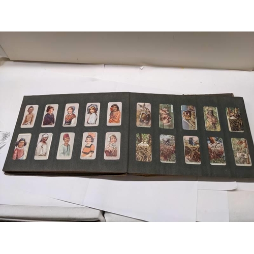 194 - A good selection of cigarette cards in albums.