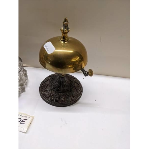 200E - A brass shop bell and a glass inkwell with brass top.