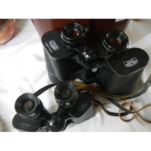 322 - A cased pair of Carl Zeiss binoculars and a pair of Delacroix Paris binoculars.