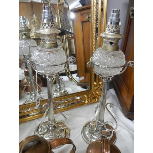 324 - A pair of Victorian Hukin & Heath silver plated oil lamps (burners converted to electric, fonts not ... 