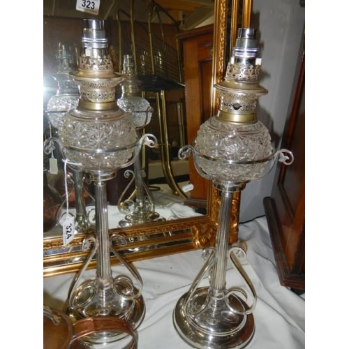 324 - A pair of Victorian Hukin & Heath silver plated oil lamps (burners converted to electric, fonts not ... 