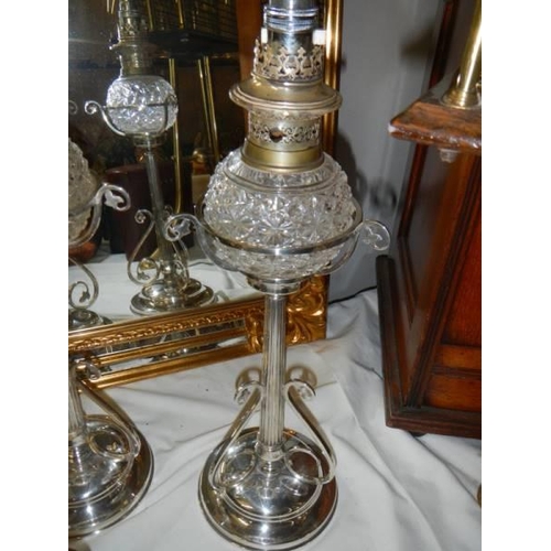 324 - A pair of Victorian Hukin & Heath silver plated oil lamps (burners converted to electric, fonts not ... 