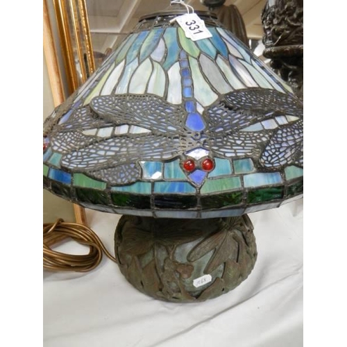 331 - A bronze table lamp with Tiffany style dragon fly shade.