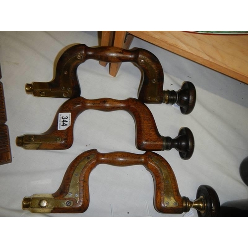 344 - Three antique brass mounted braces.