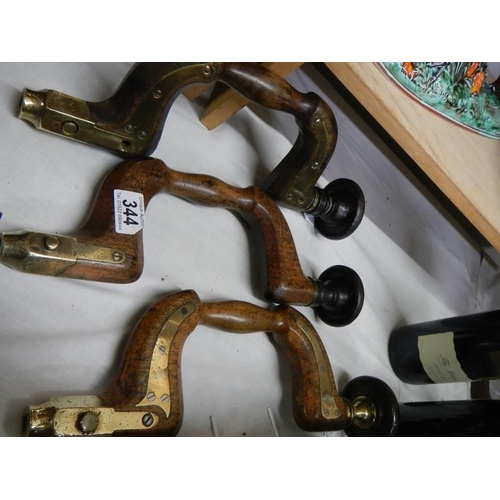 344 - Three antique brass mounted braces.