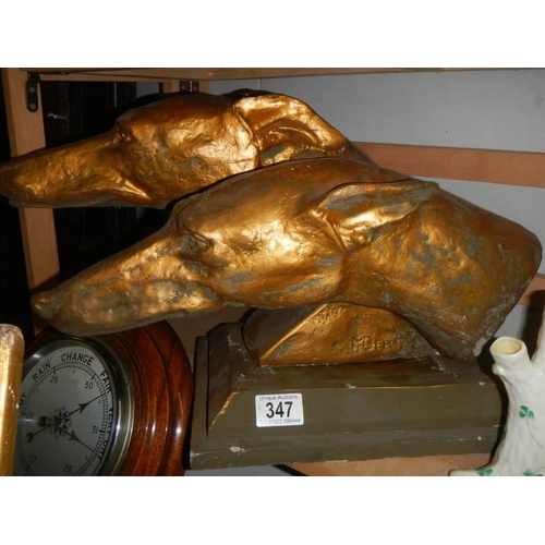 347 - A signed sculpture of two greyhound heads. COLLECT ONLY.