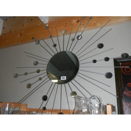 360 - A sunburst mirror.