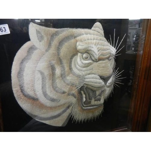 363 - A framed and glazed embroidered tiger head. COLLECT ONLY.