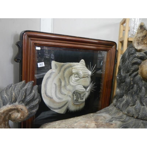 363 - A framed and glazed embroidered tiger head. COLLECT ONLY.