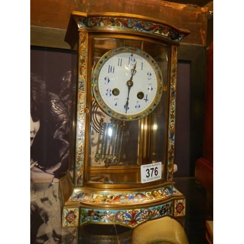 376 - A brass and cloissonne' eight day mantel clock.