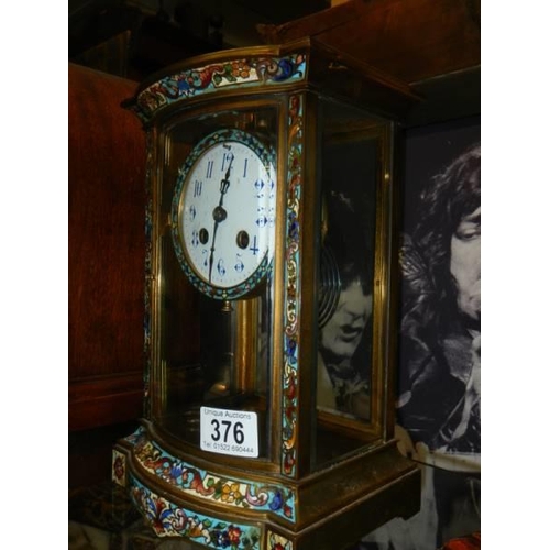 376 - A brass and cloissonne' eight day mantel clock.