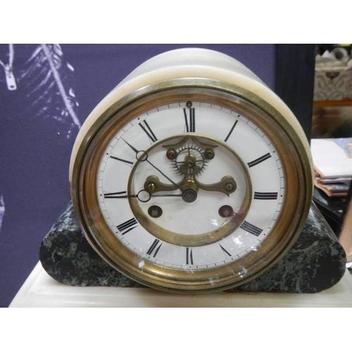 378 - An 8 day marble clock garniture.