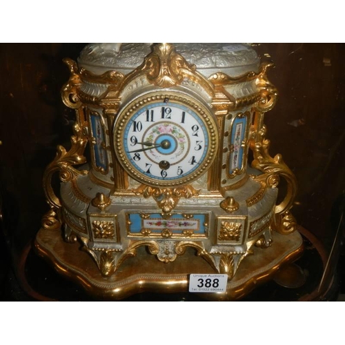 388 - A magnificent French clock garniture under glass domes.  The clock surmounted a horse with handler, ... 