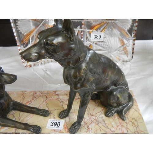 390 - An art deco sculpture of two Alsation dogs on a marble base.