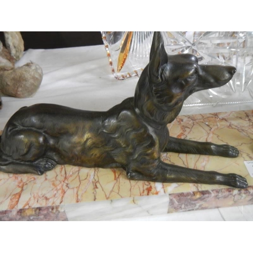 390 - An art deco sculpture of two Alsation dogs on a marble base.