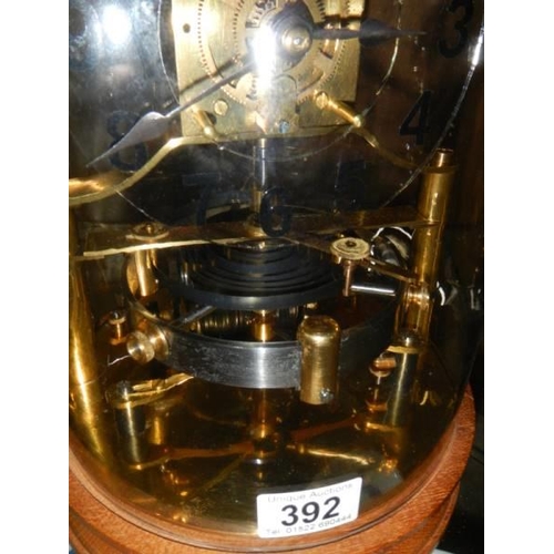 392 - A late 20th century electric magnetic hip toggle great balance wheel clock, will need new batteries ... 