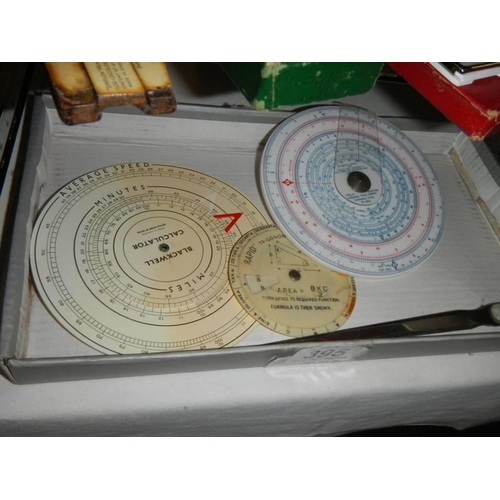 395 - A mixed lot of various slide rules including circular types.