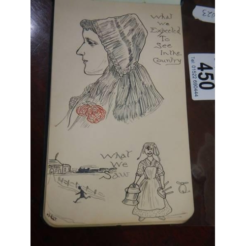 450 - An early 20th century autograph book containing verses and drawings.