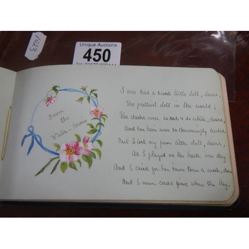 450 - An early 20th century autograph book containing verses and drawings.