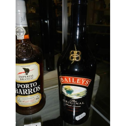 494 - Two bottles of port and a bottle of Baileys.