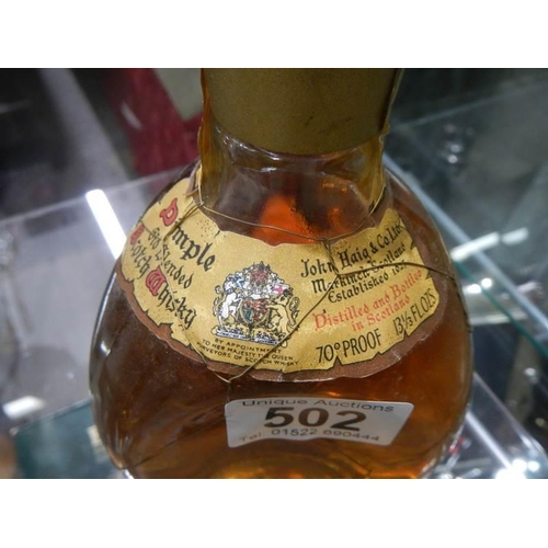 502 - A bottle of Dimple Whisky won in a raffle 60 years ago.