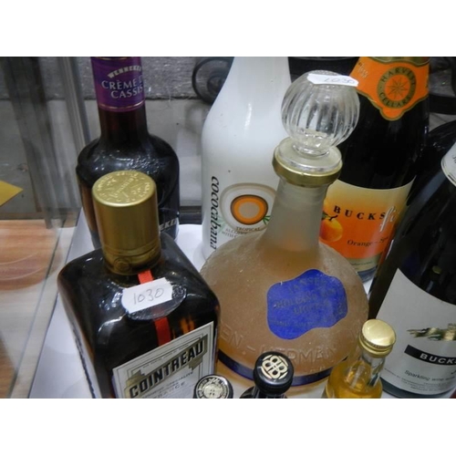 505 - Eight large and nine small bottles of assorted wines and spirits.