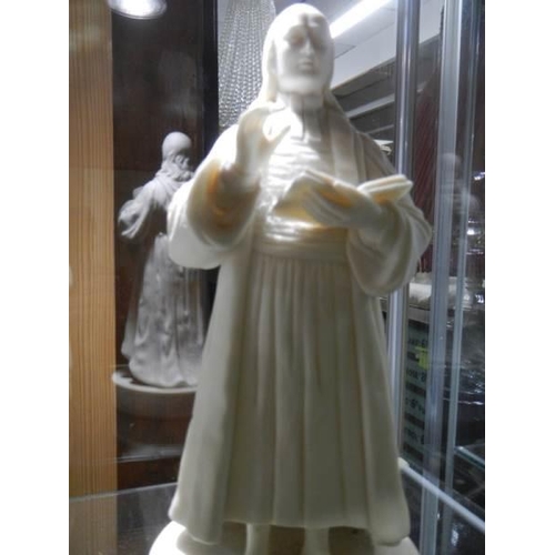 506 - A 19th century Parian figure of John Wesley and one other.