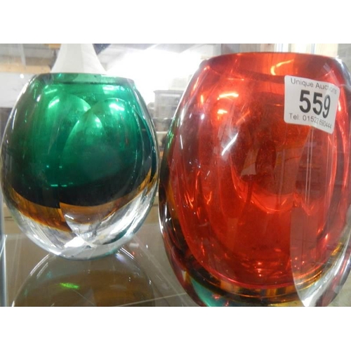 559 - Three heavy glass retro style vases.