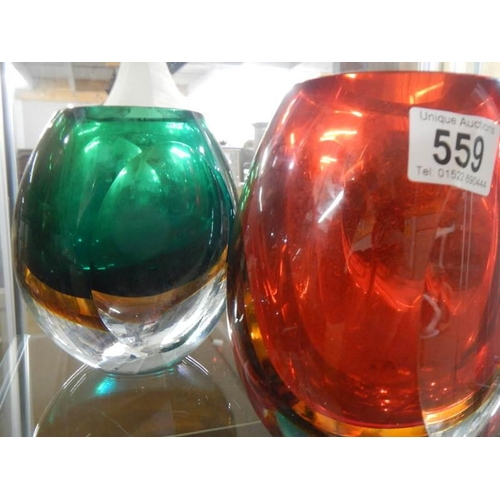 559 - Three heavy glass retro style vases.