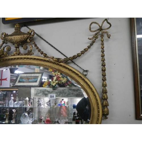 584 - An early 19th century gilt framed mirror (back needs attention).