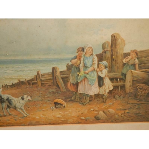 614 - An early 20th century framed and glazed print featuring children on a beach, 88 x 65 cm.