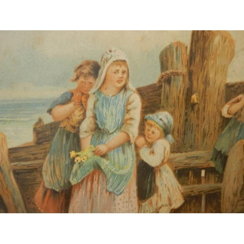 614 - An early 20th century framed and glazed print featuring children on a beach, 88 x 65 cm.