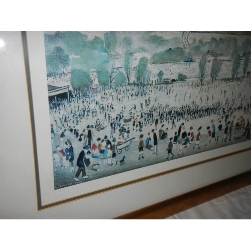 627 - A framed and glazed L S Lowry print, signed and dated 1944. 81 x 52 cm