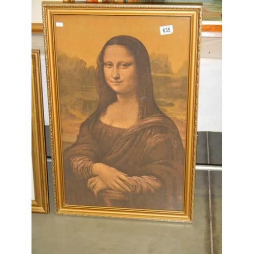 635 - A framed print on silk of the Mona Lisa. 74 x 49 cm.